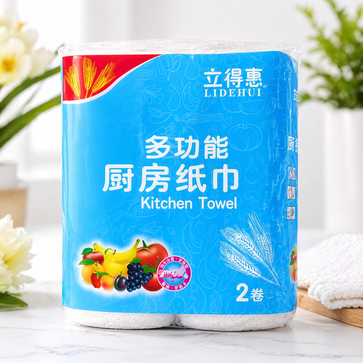 Kitchen towel pack with blue packaging, featuring fruit illustrations and white embossed texture, 2 rolls.
